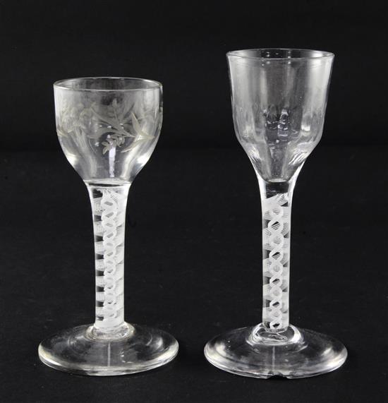 Two double series opaque twist stem wine glasses, c.1770, 13cm and 14cm, latter rim chipped